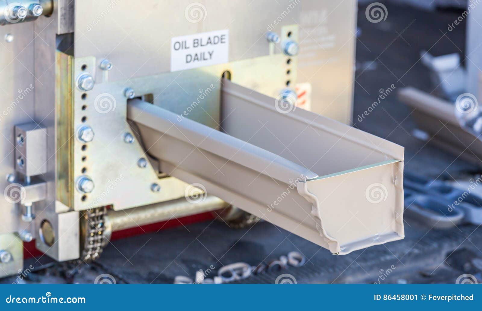 Rain Gutter Feeding through Seamless Shaping Machine Stock Image