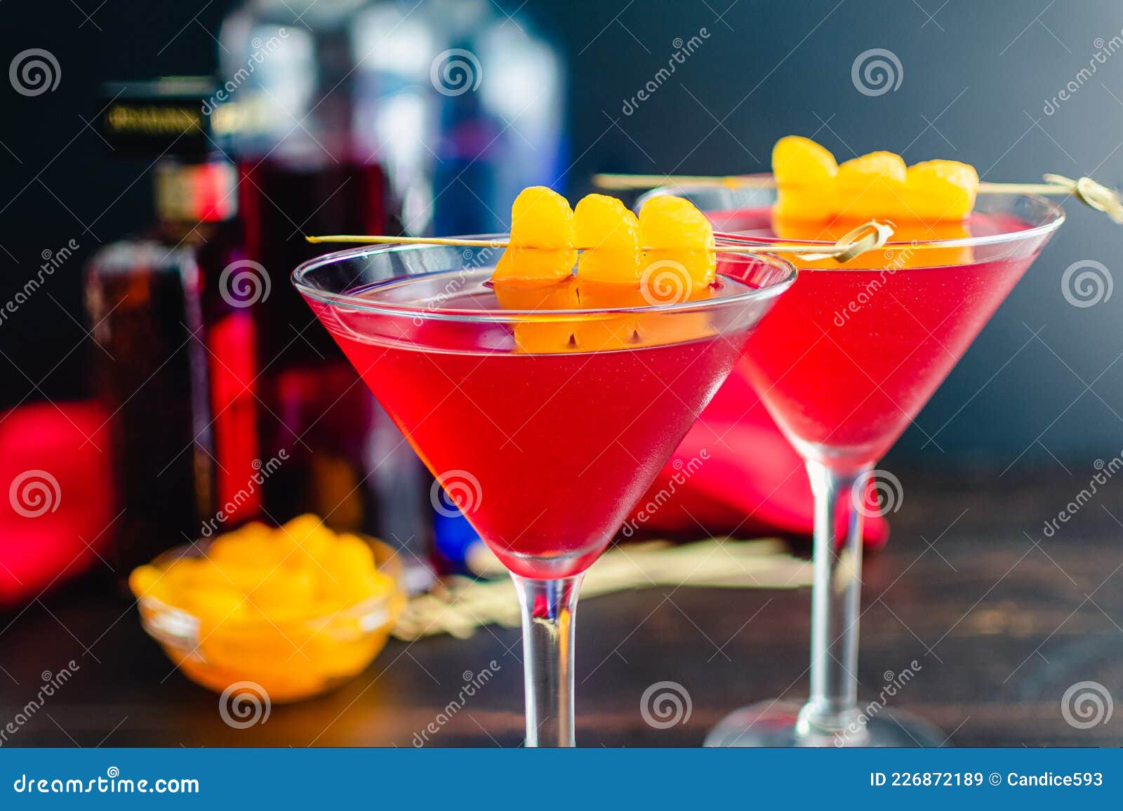 AmarettoCranberry Kiss Cocktails with Mandarin Orange Garnish Stock