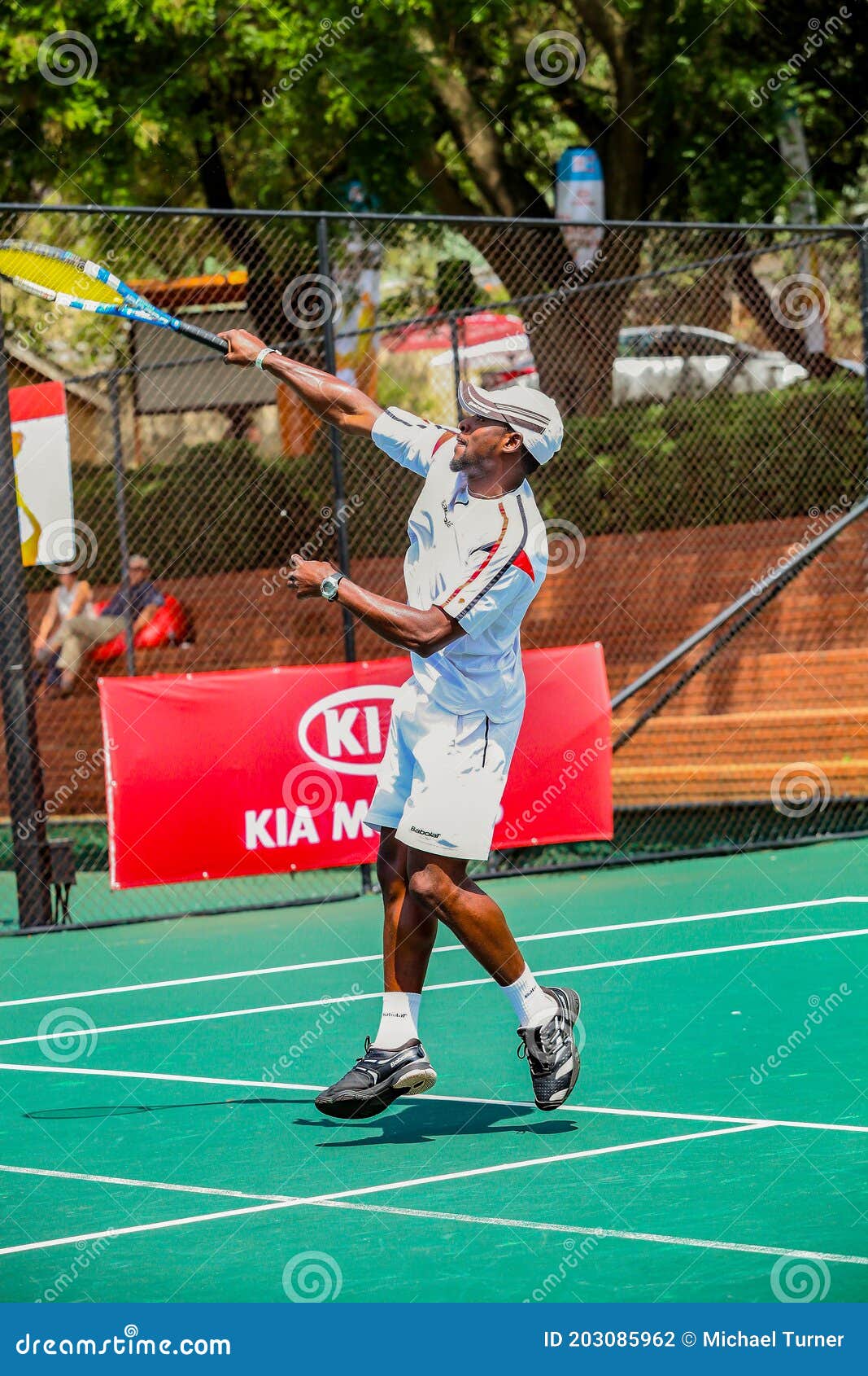 Amateur Black African Male Tennis Player Practicing on a Sunny Day
