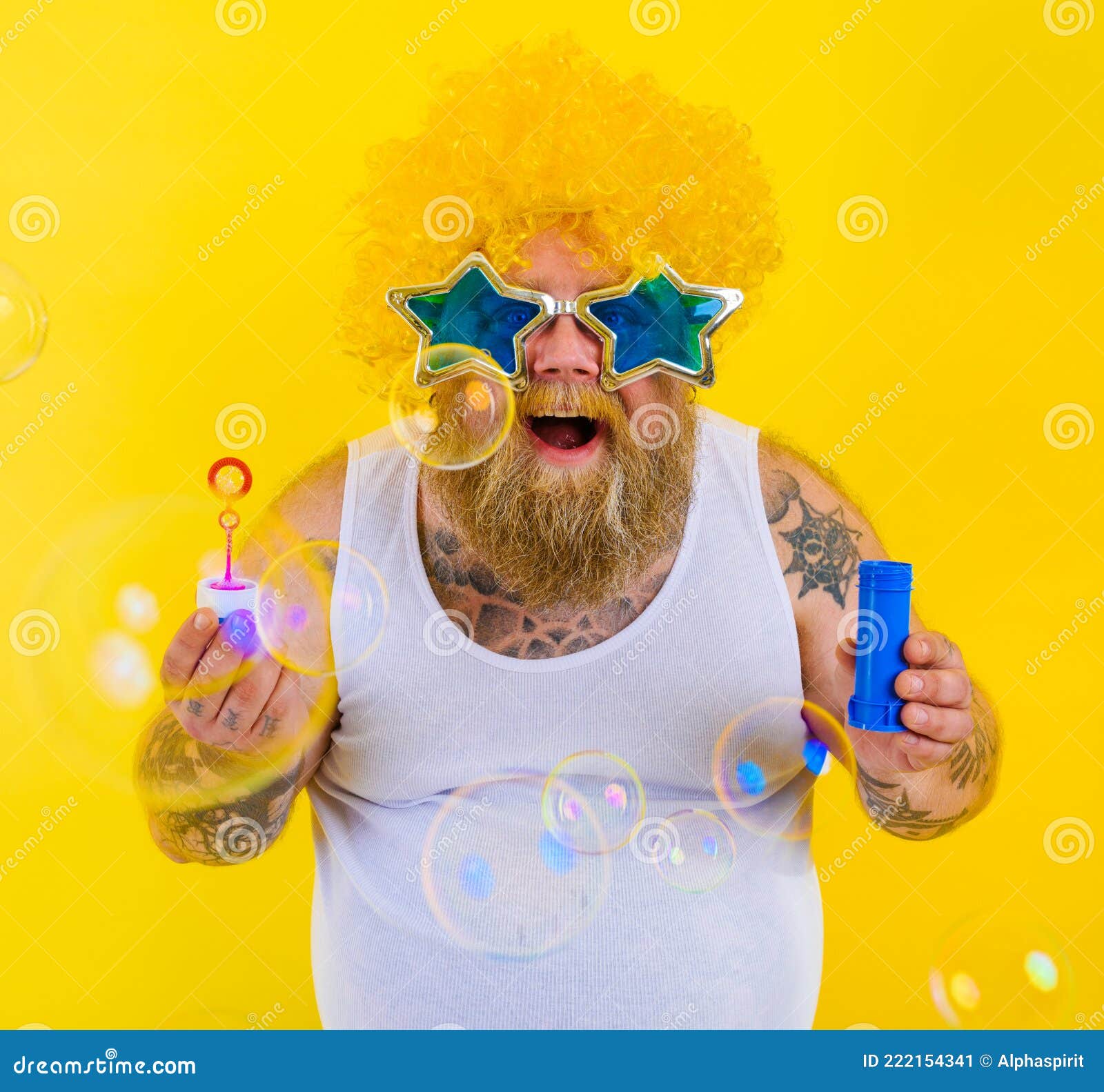 Amazed Man with Yellow Wig in Head Play with Bubbles Soap Stock Image