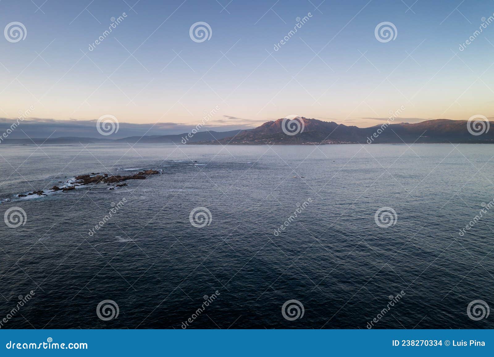 amazing drone aerial landscape view of mountains in atlantic ocean with waves at sunset in caldebarcos in galiza, spain