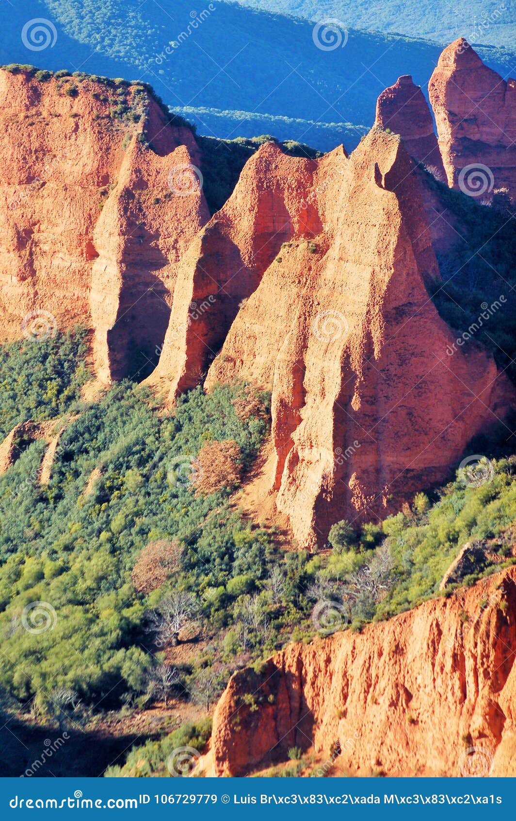 amazing landscape of orange mountains. maravilloso paisaje de montaÃÂ±as anaranjadas con un verde horizonte. ancient roman mines.