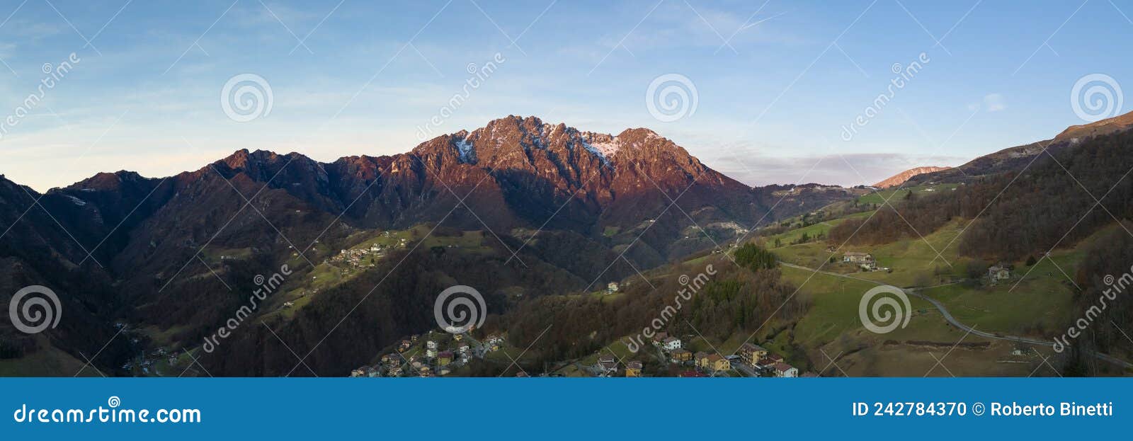 amazing landscape photo of the seriana valley and its mountains at sunrise