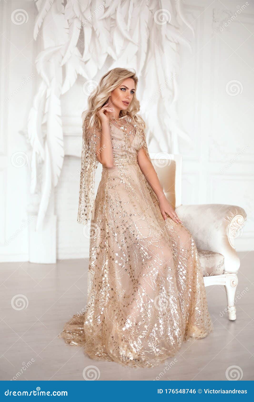 Amazing Luxury Elegant Woman in Stylish Golden Party Dress Posing before  White Feathers Wall. Fashion Beautiful Sensual Female Stock Photo - Image  of elegance, beauty: 176548746
