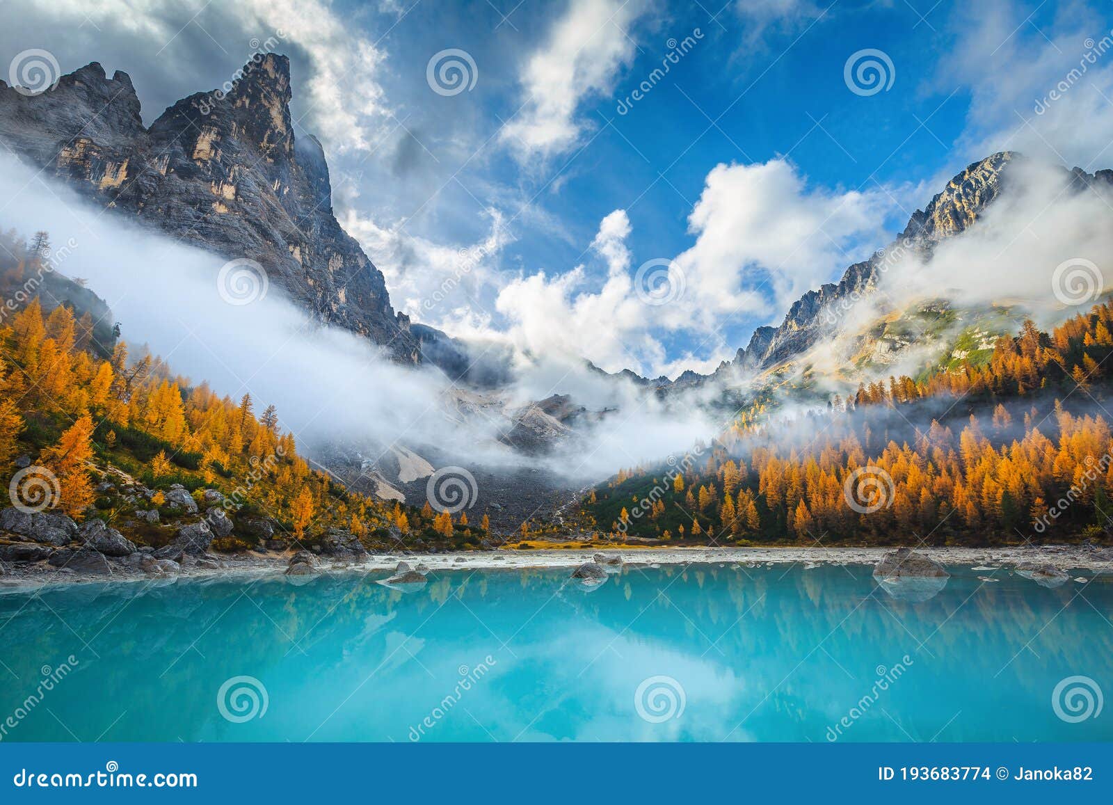amazing misty autumn scenery with lake sorapis, dolomites, italy