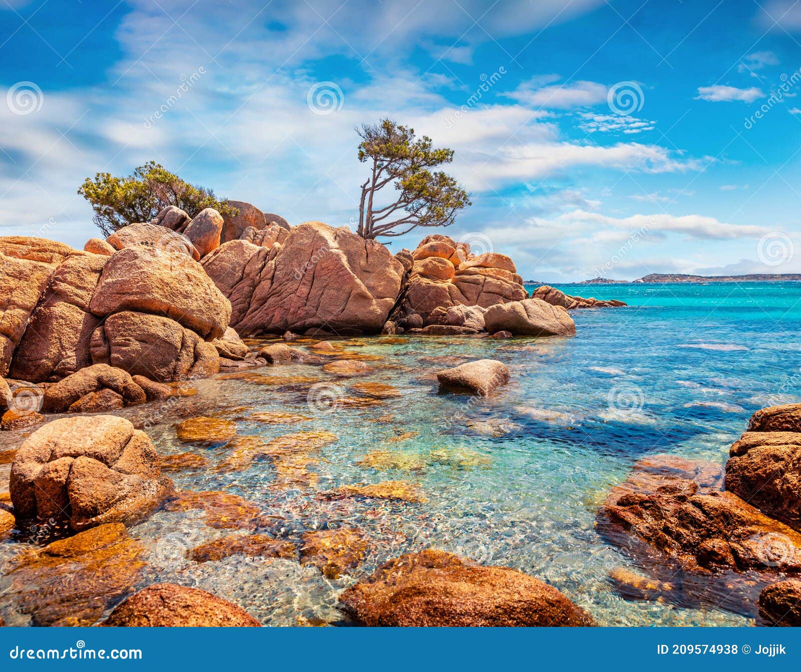 amazing morning scene of popular touris deastination - capriccioli beach. scenic public beach with sand & granite rocks nestled in