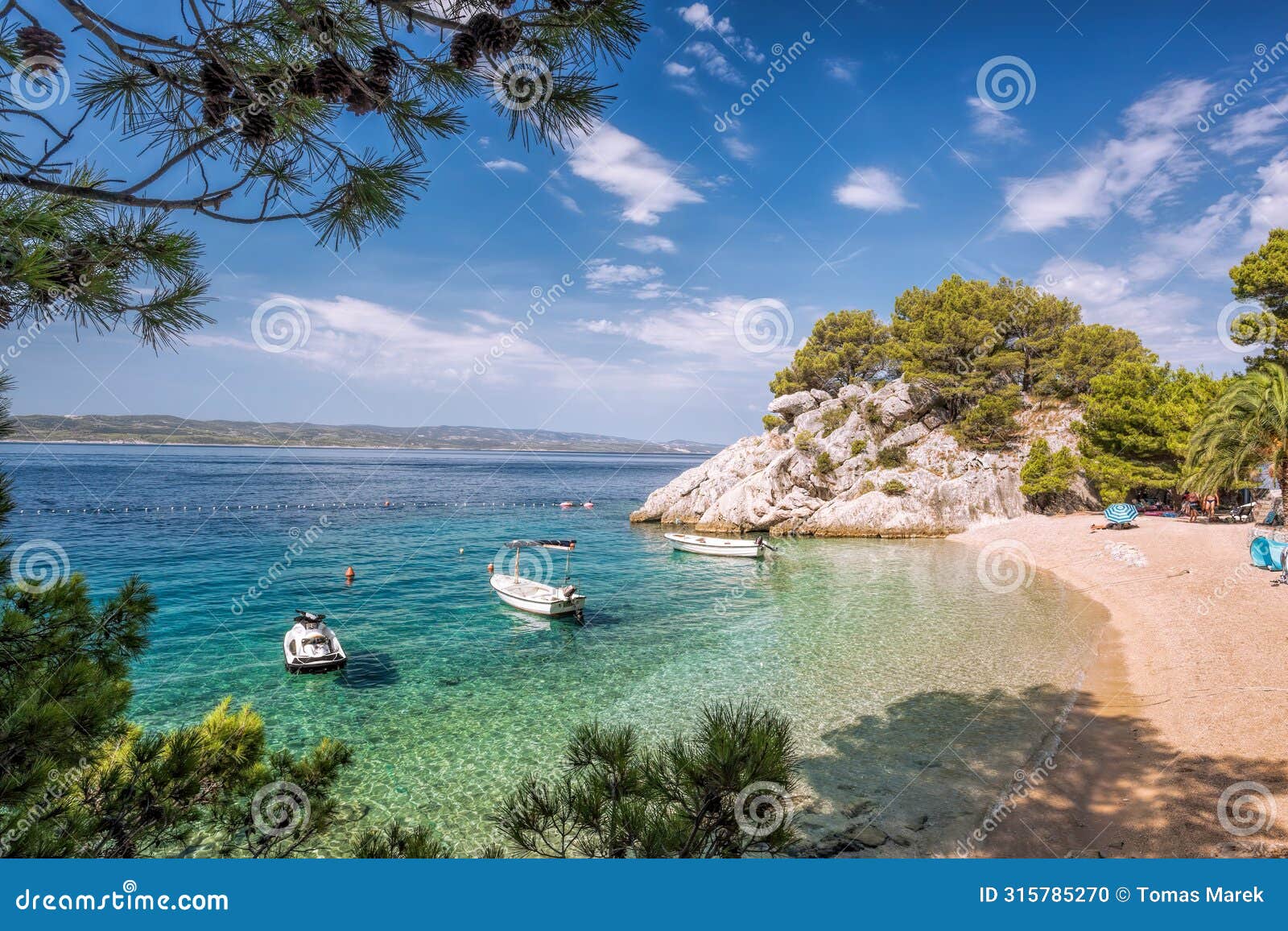 amazing punta rata beach with boats against azure sea in brela, makarska, dalmatia, croatian azure coast