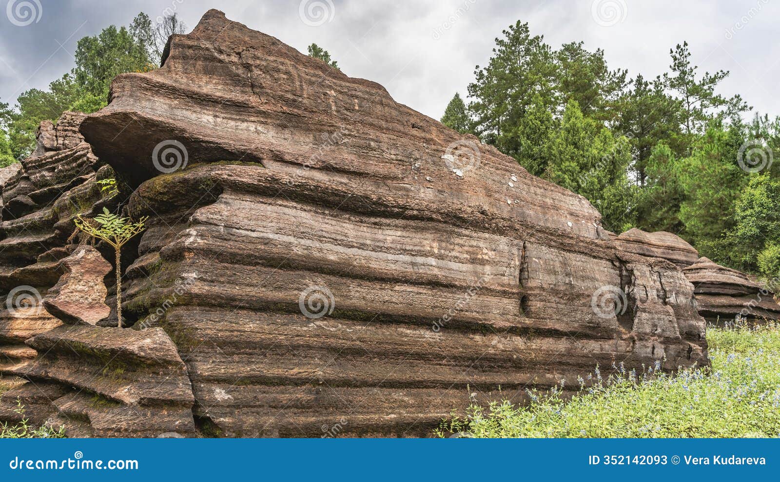 amazing red-brown karst rocks. steep undulating slopes with layered structure.