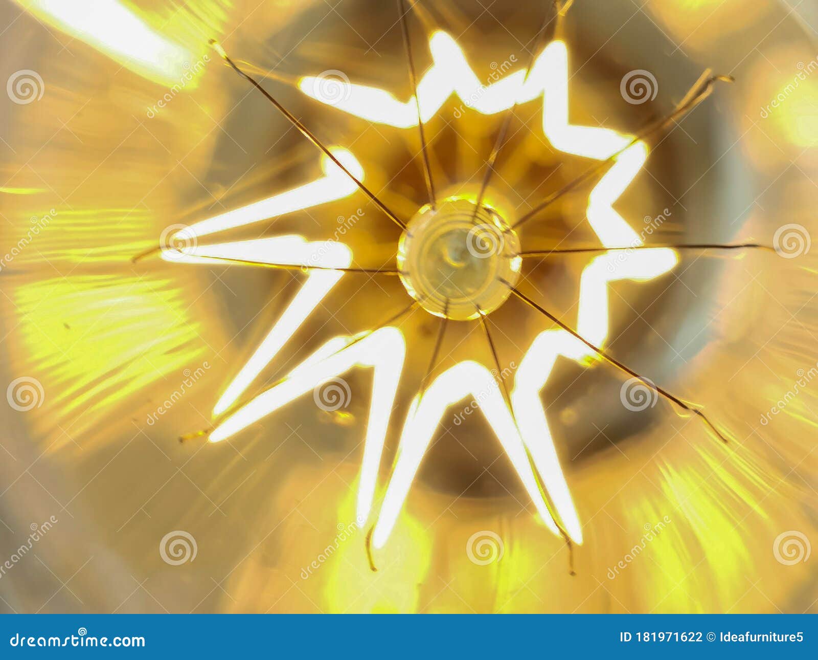 Electricity Current Inside a Retro Crystal Clear Light Bulb. Stock