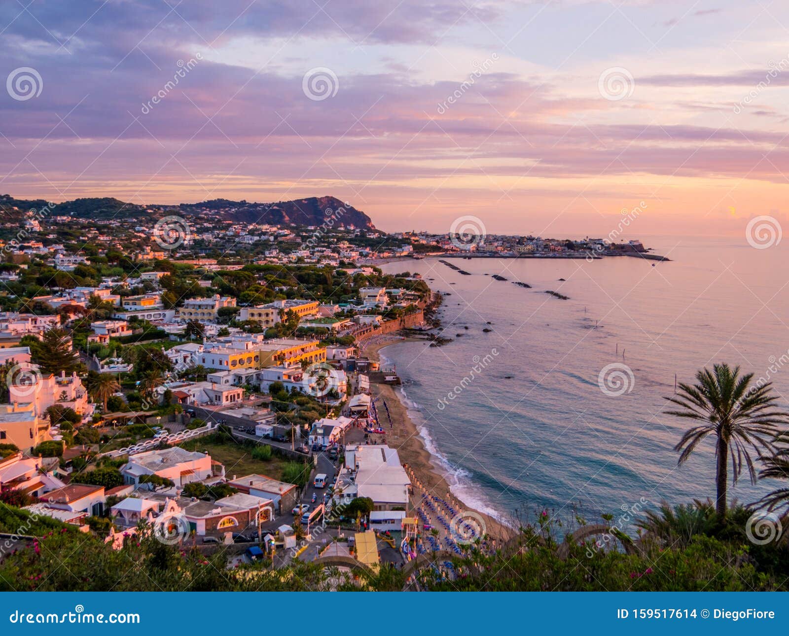 sunset over forio, ischia island, italy