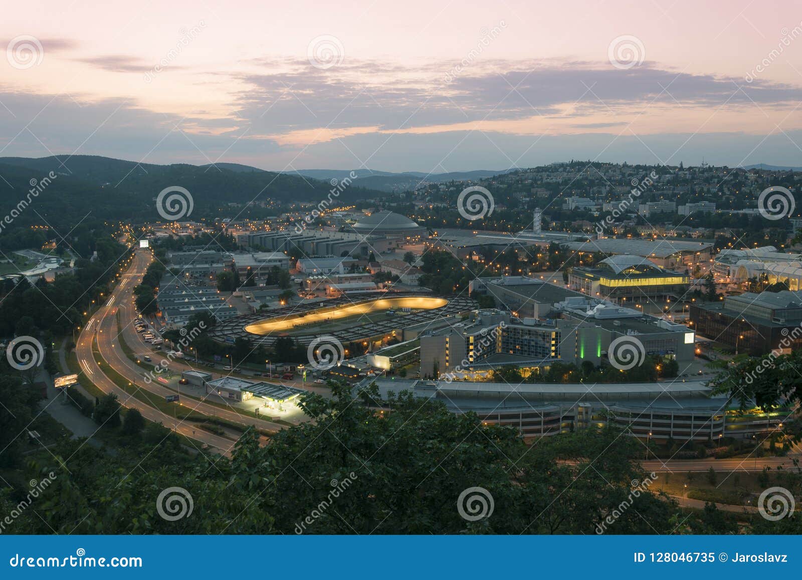 amazing top view on brno city, czech republic at summer evening. area around exhibition center, road, buildings, hotels, velodrome