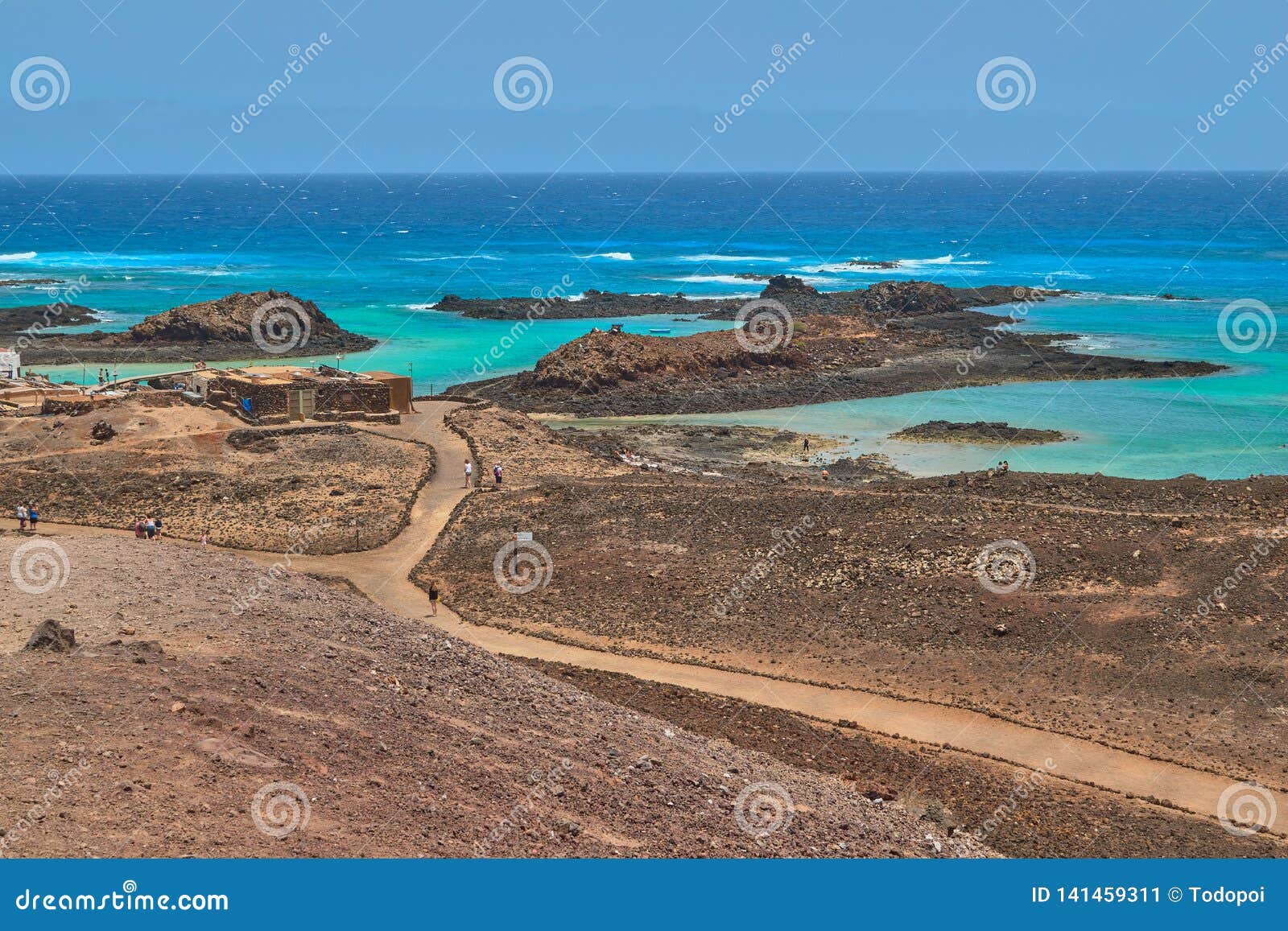 isla de lobos with turquoise sea and waves in fuerteventura