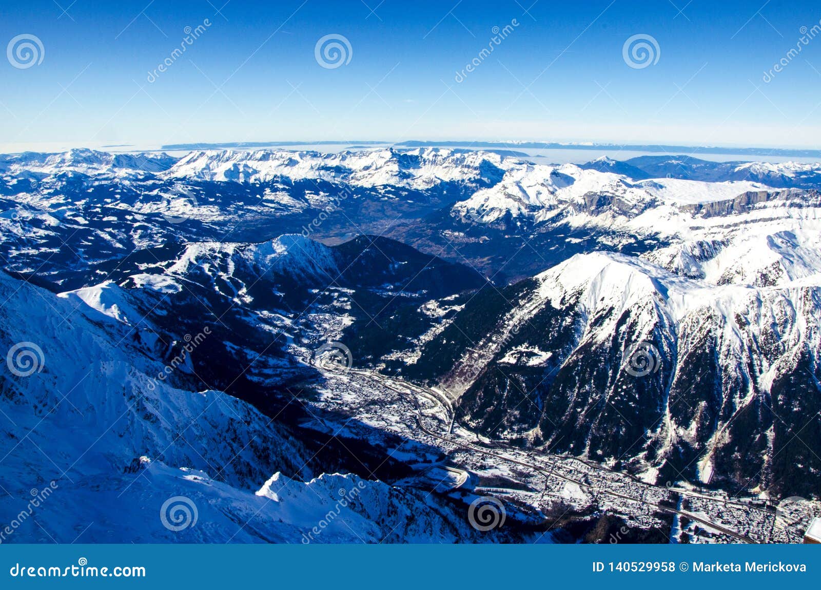 amazing view of french town called chamonix-mont-blanc. all around the summits of alps covered with snow.