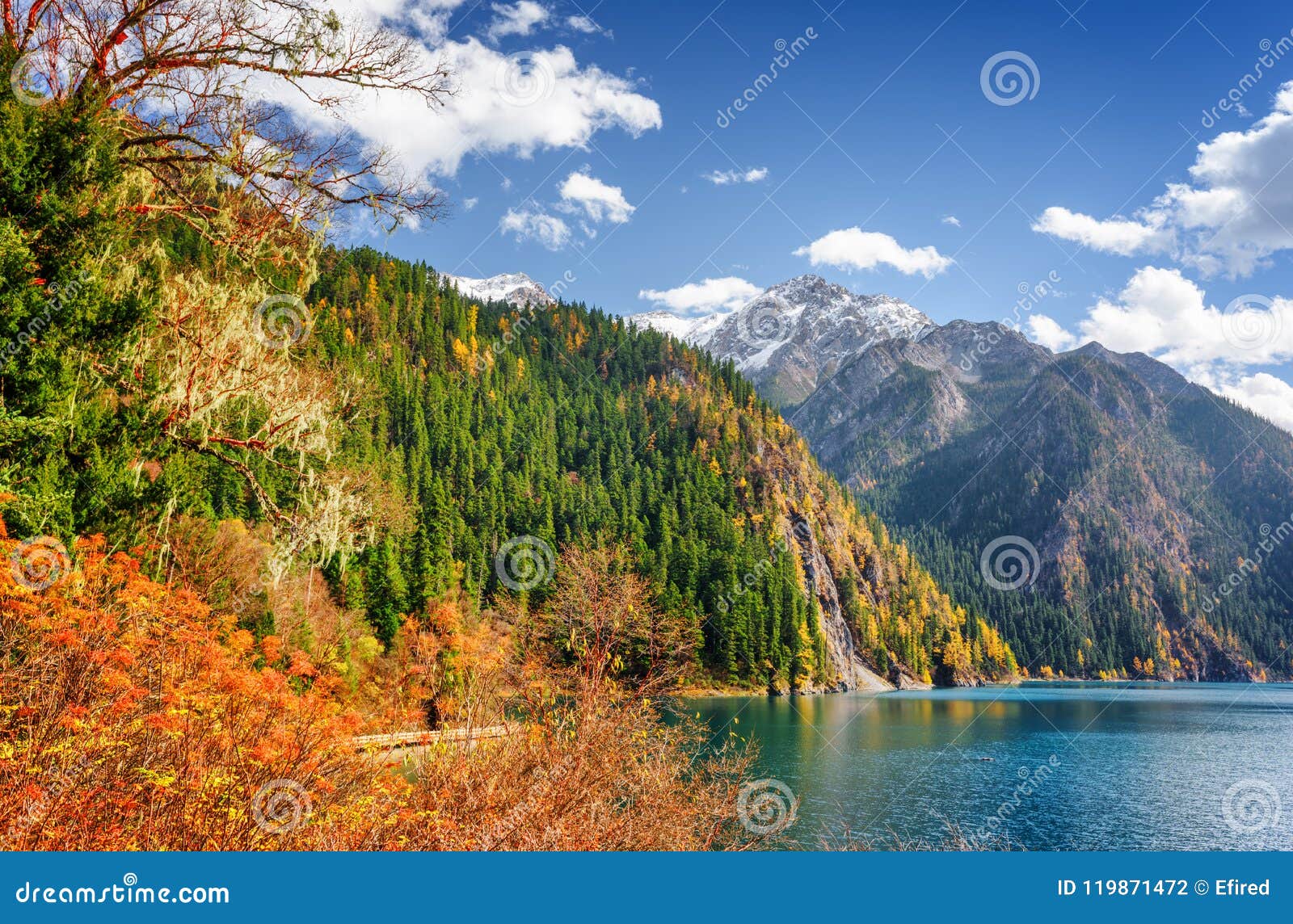 Scenic View Of The Long Lake Among Fall Woods And Mountains Stock Photo