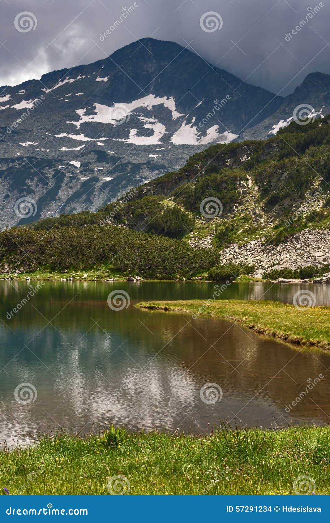 amazing view of muratovo lake and reflection of banski suhodol peak, pirin mountain