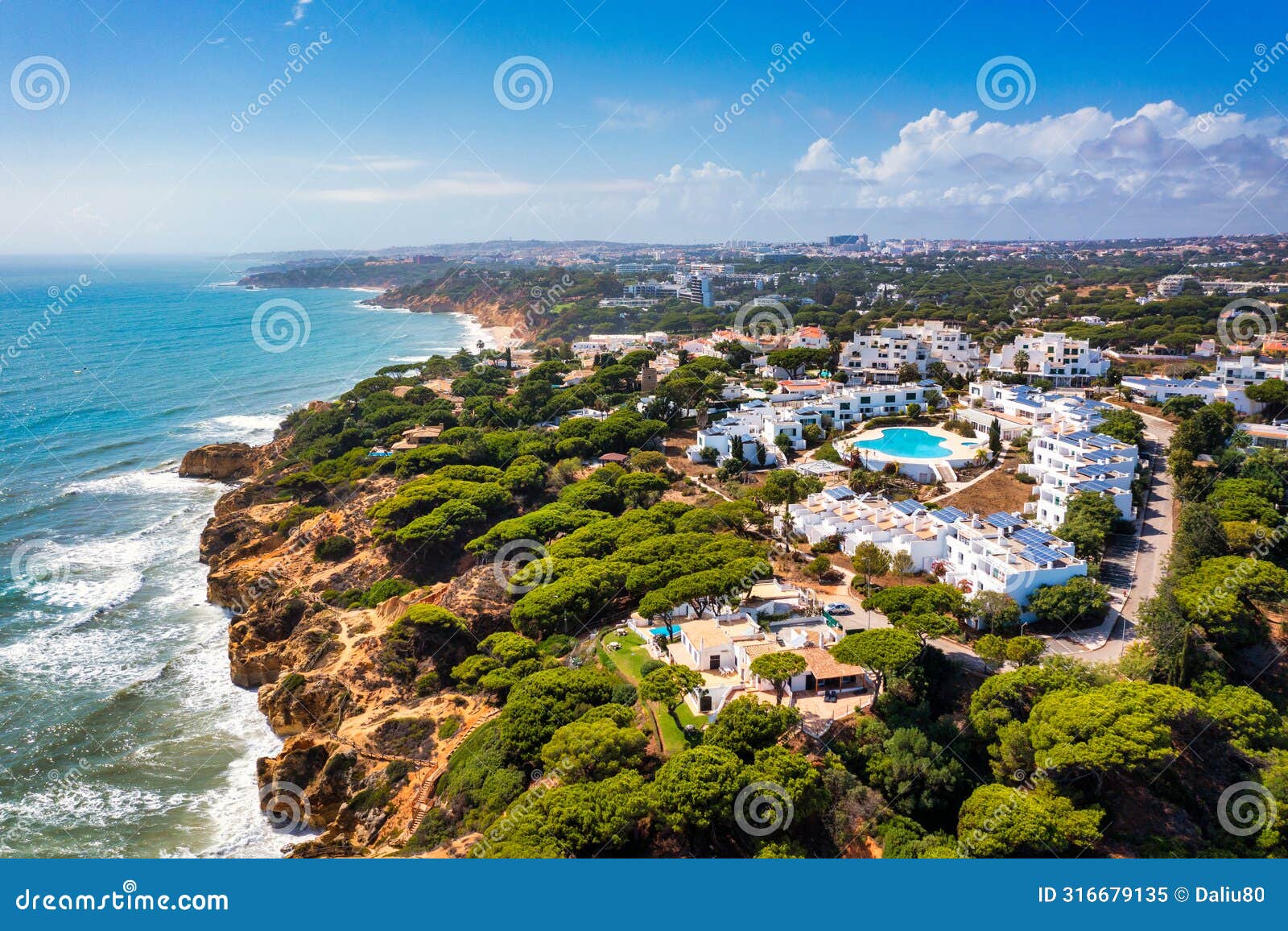 amazing view from the sky of town olhos de agua in albufeira, algarve, portugal. aerial coastal view of town olhos de agua,