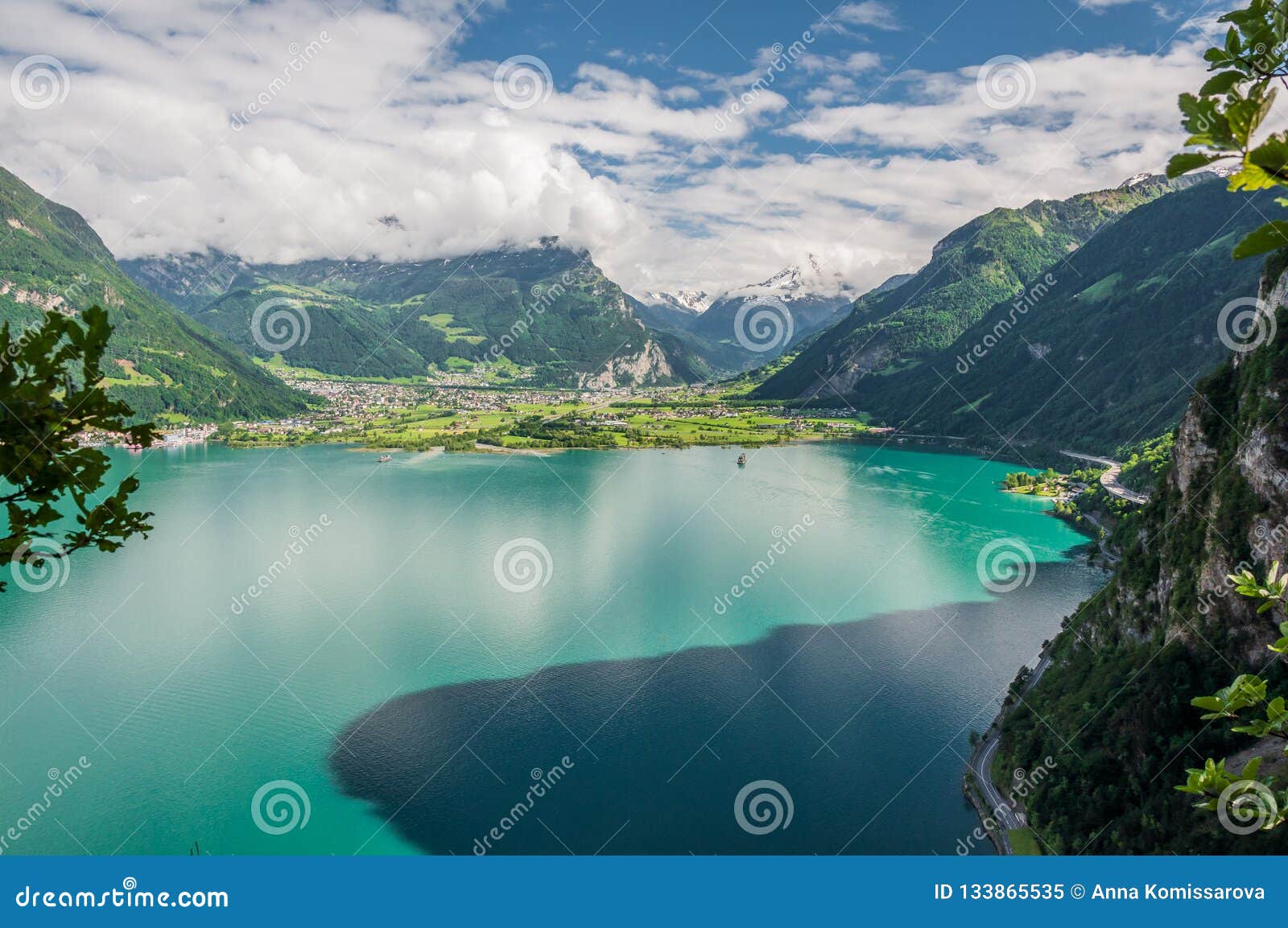 tourquise lake, roads and swiss alps in switzerland