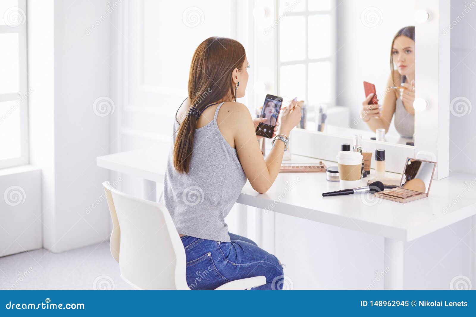 Amazing Young Woman Doing Her Makeup In Front Of Mirror Portrait Of 