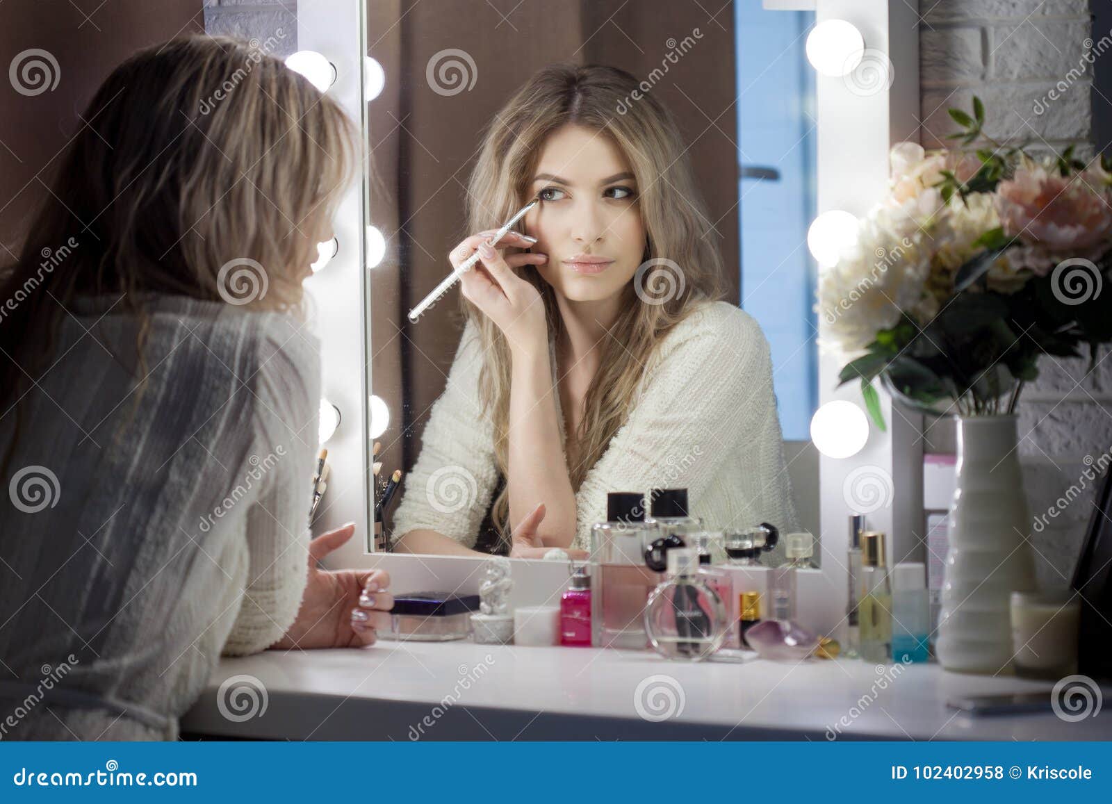 Amazing Young Woman Doing Her Makeup In Front Of Mirror Portrait Of 