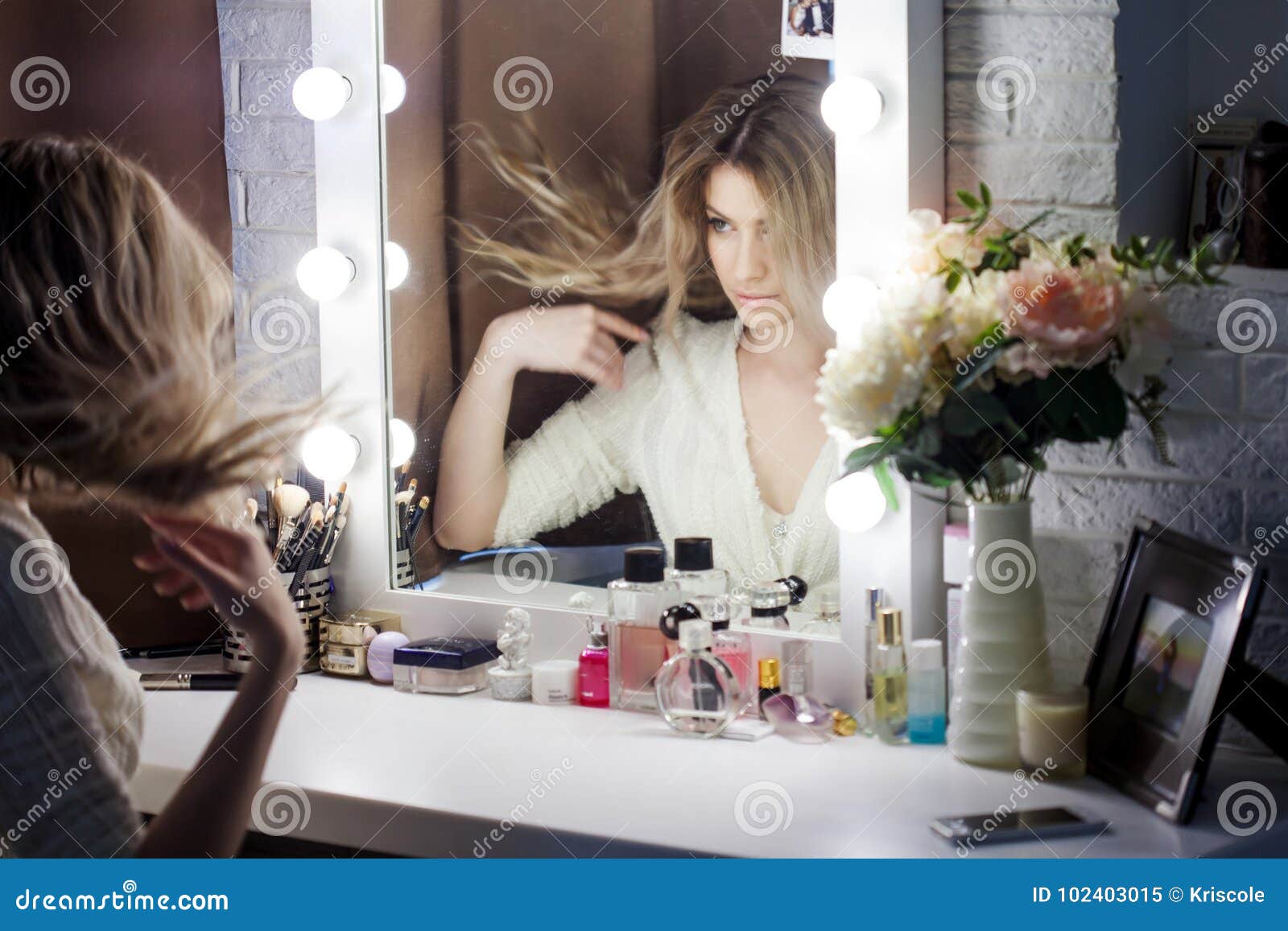 Amazing Young Woman Doing Her Makeup In Front Of Mirror Portrait Of 