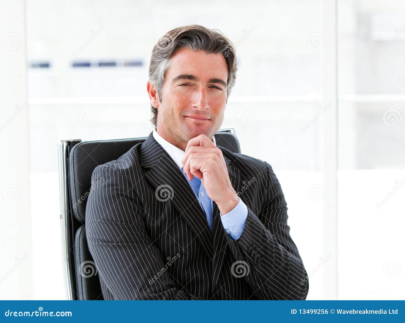 ambitious male executive sitting in his office