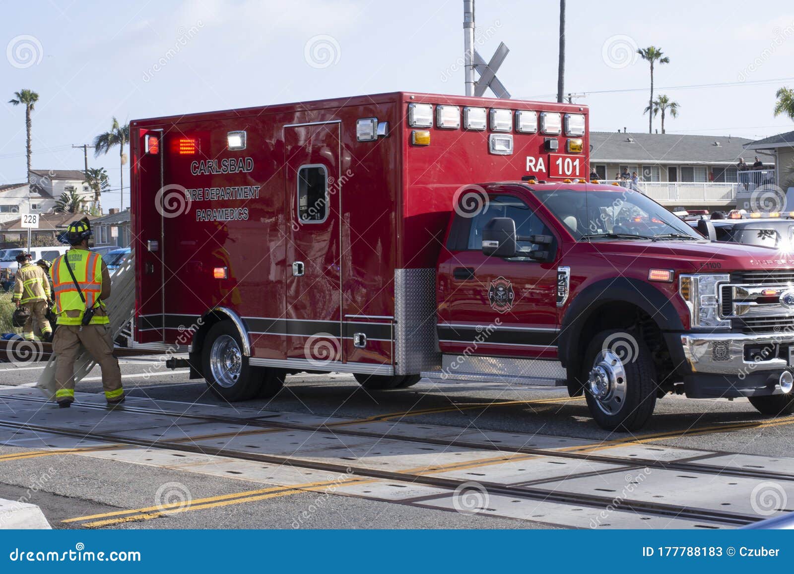 Ambulance on the Scene of an Accident Involving an SUV and a Train in
