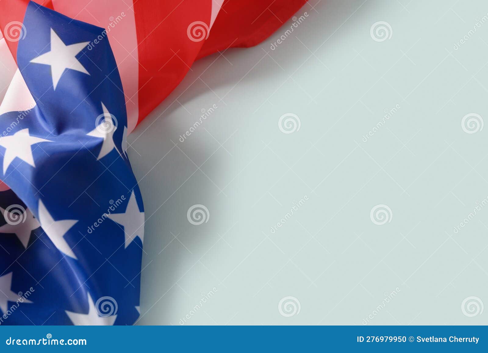 American Flag on Blue Background. Copy Space. Stock Photo Image of
