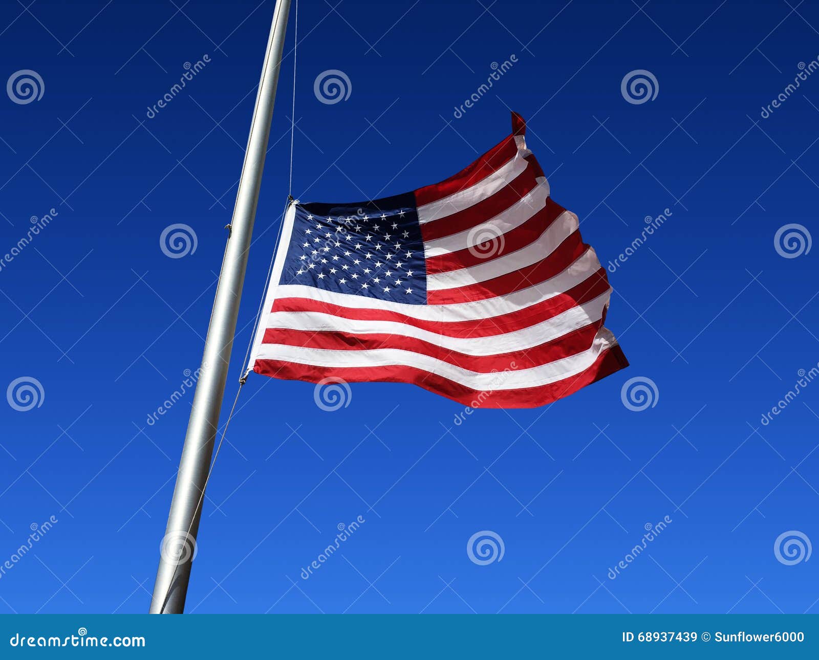 american flag is flown at half staff
