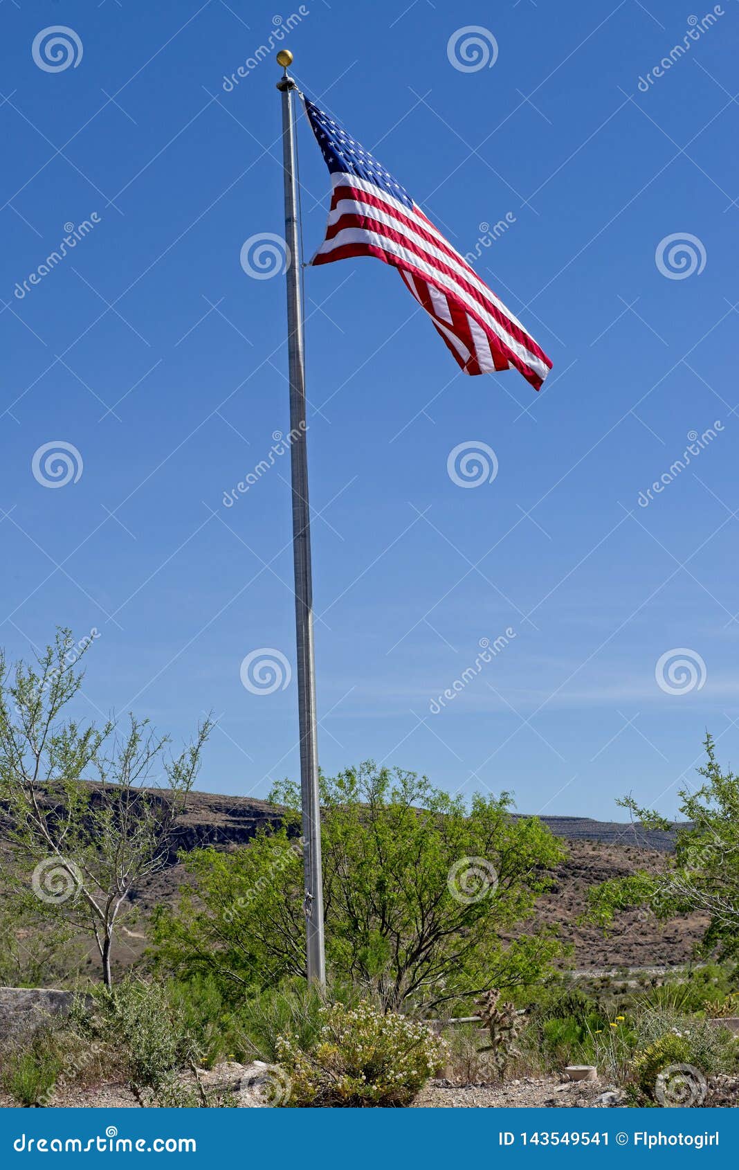 american flag flying high at visitors center of red rock canyon nature conservancy