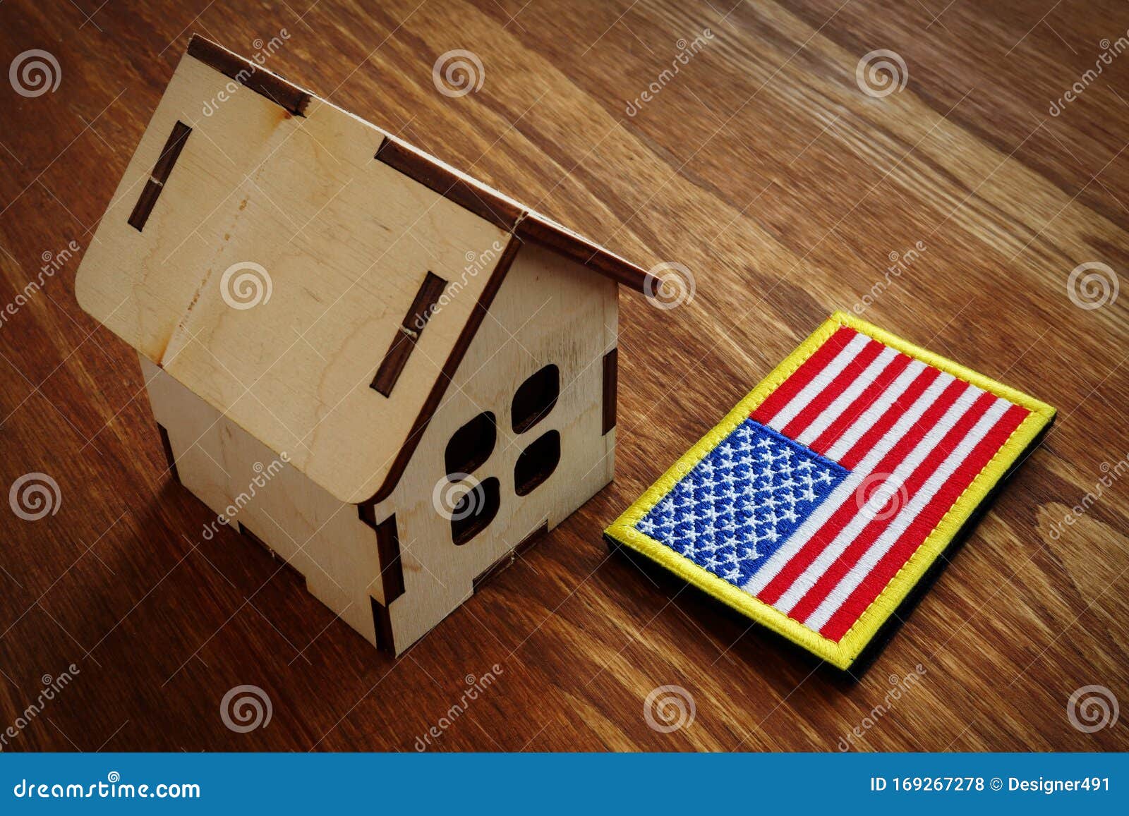 american flag and small house. va mortgage loan concept