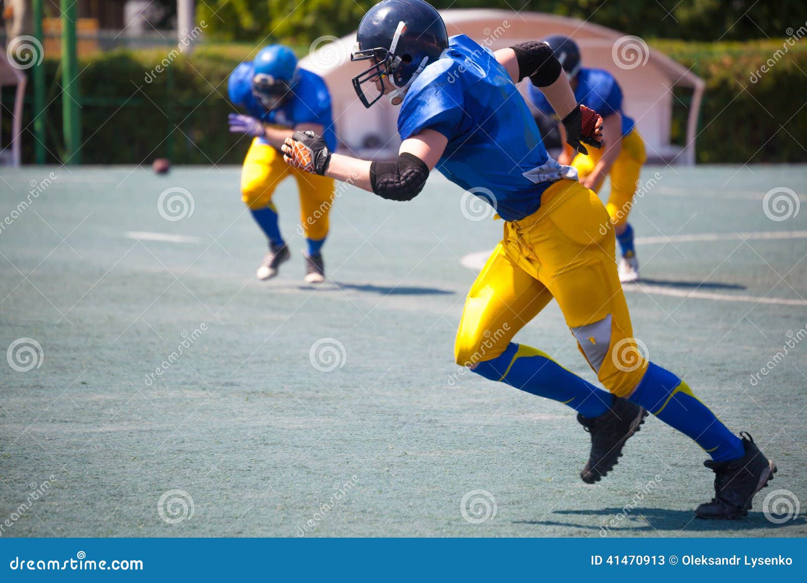 American Football Athletes Running Stock Image - Image of grass, play
