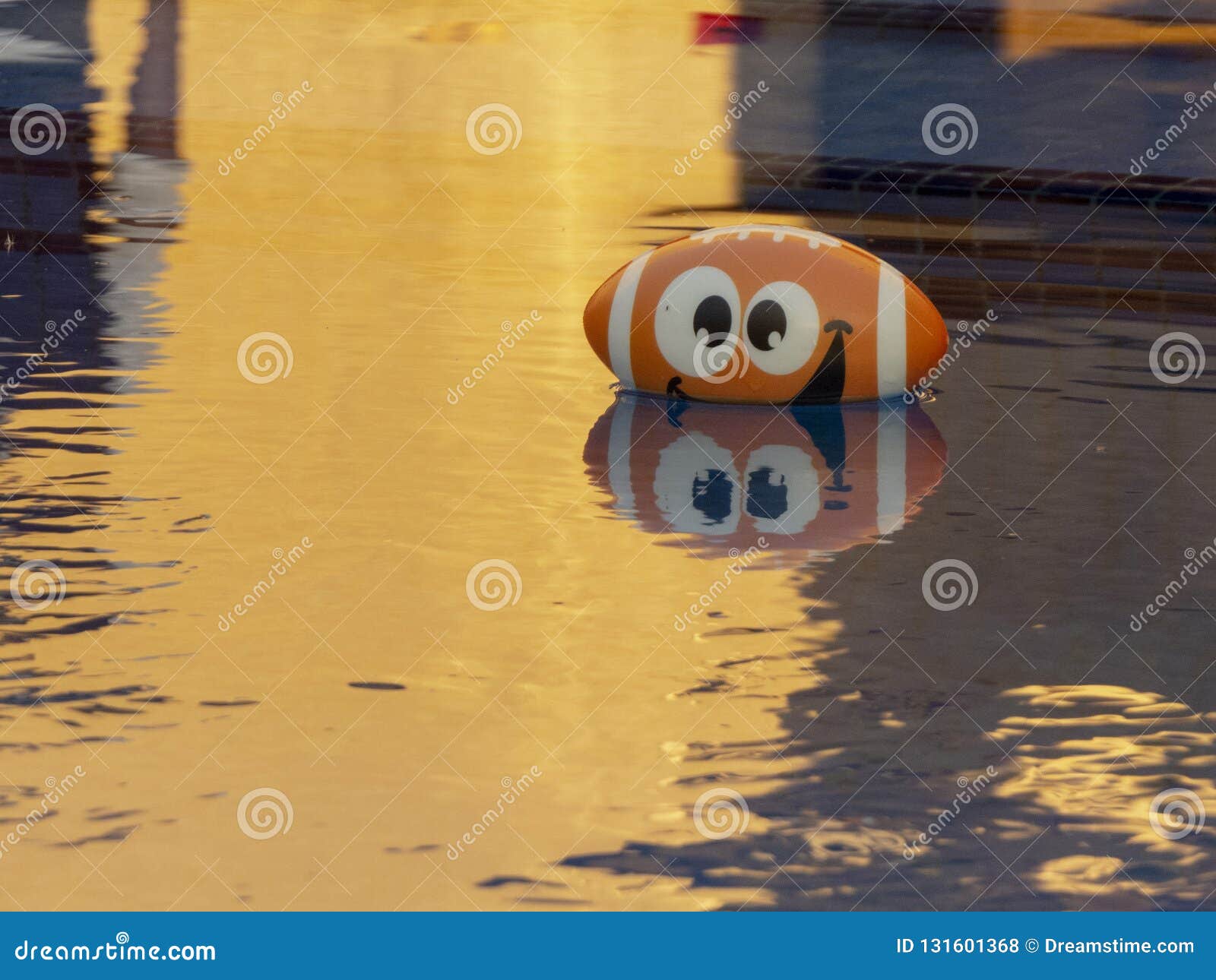 american football baloon in a pool