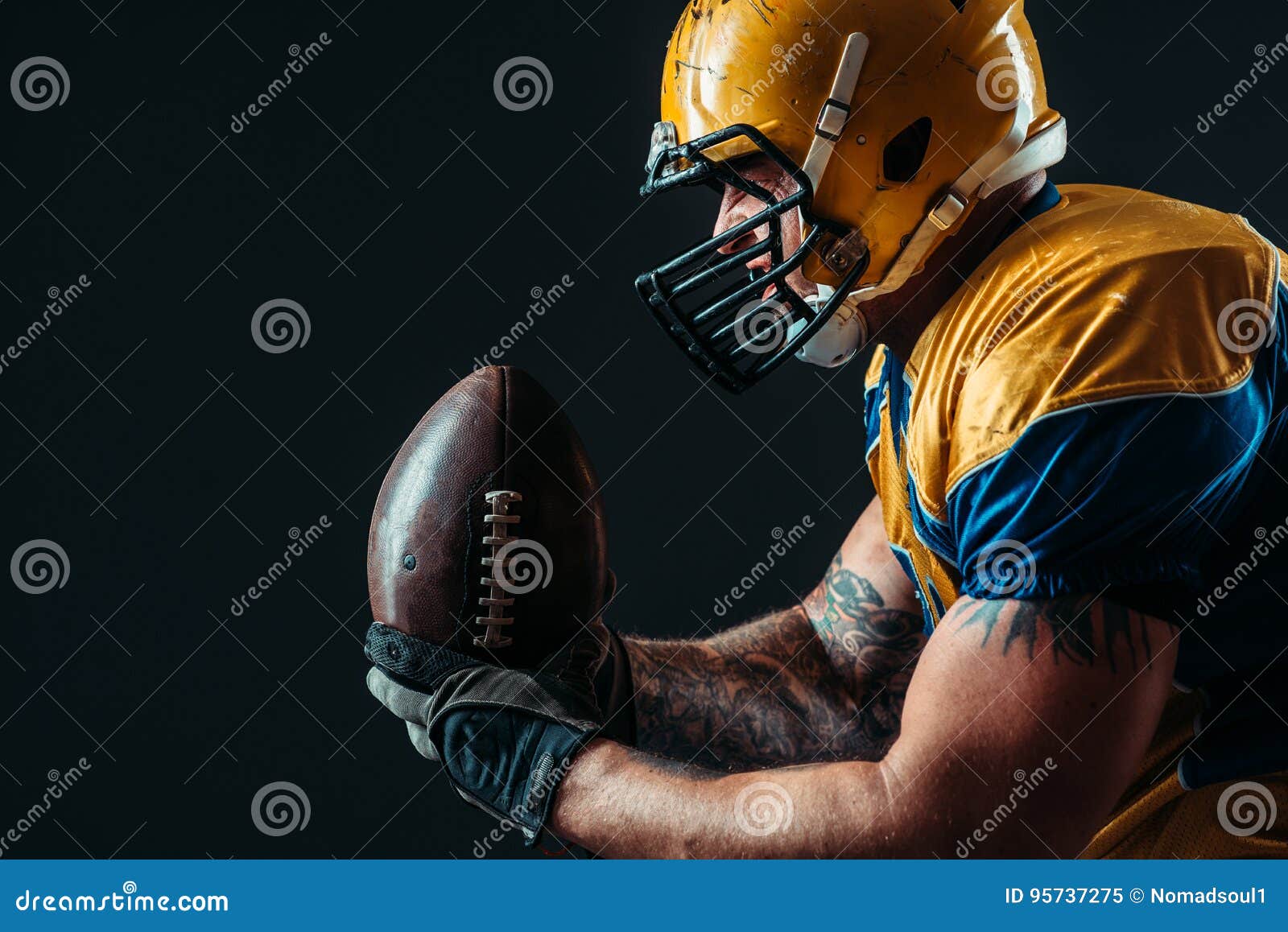 american football offensive player with ball