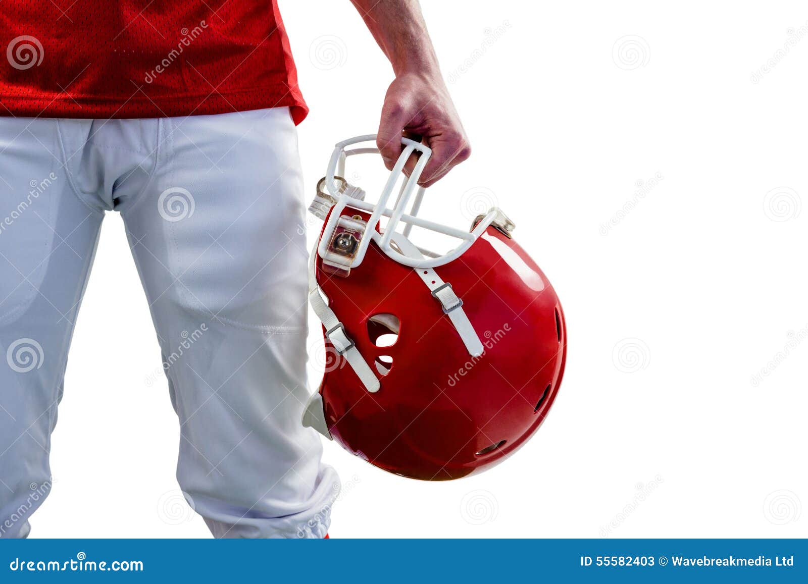 an american football player taking his helmet on hand