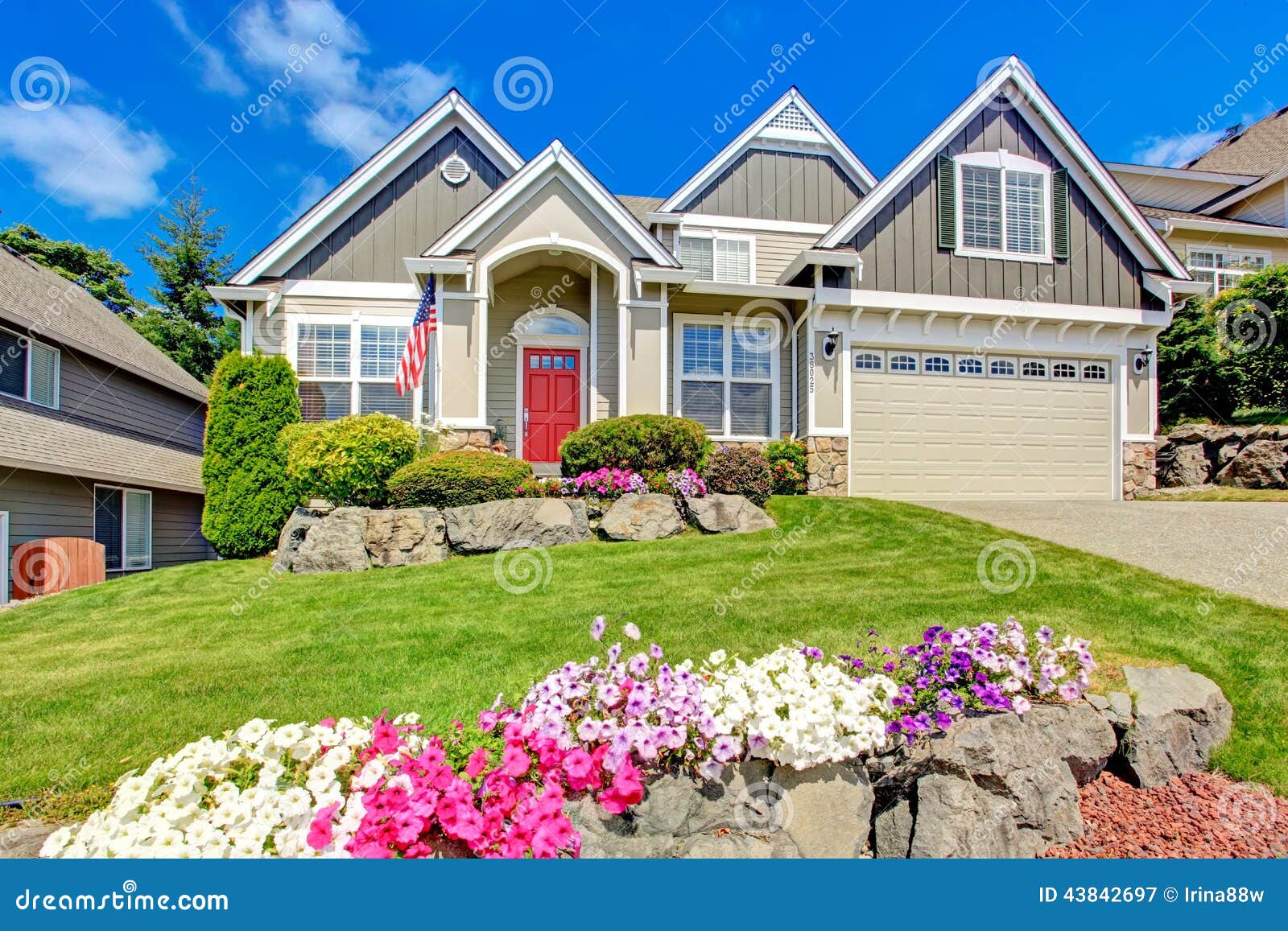 american house with beautiful landscape and vivid flowers