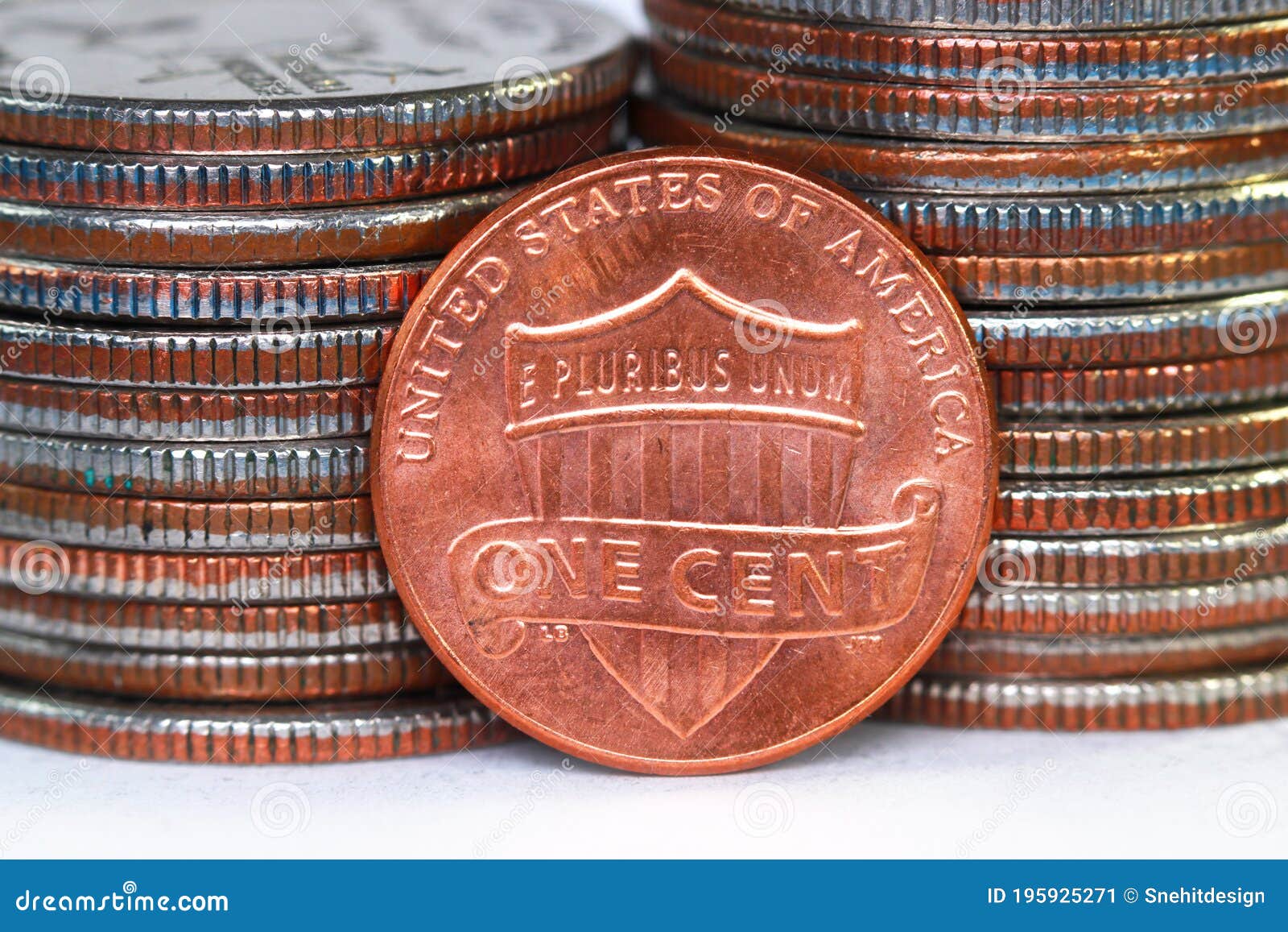 american one cent coin against quarter coins