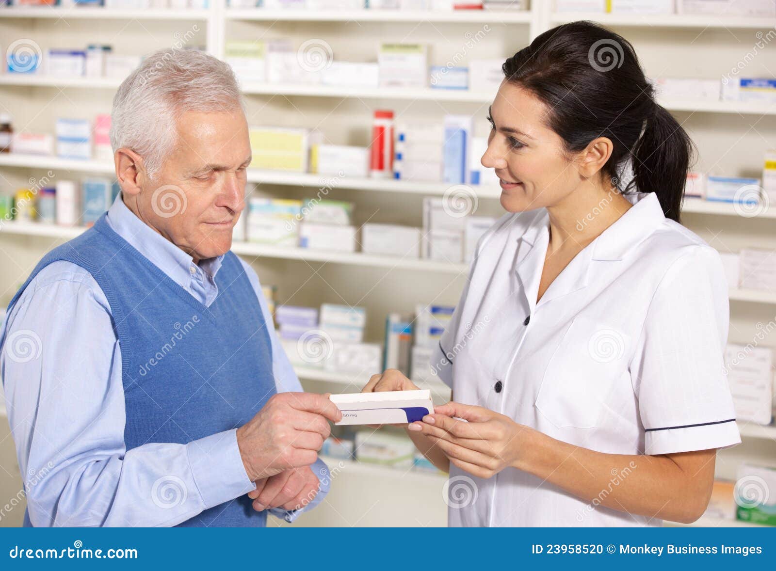 American Pharmacist Serving Senior Man in Pharmacy Stock Photo Image