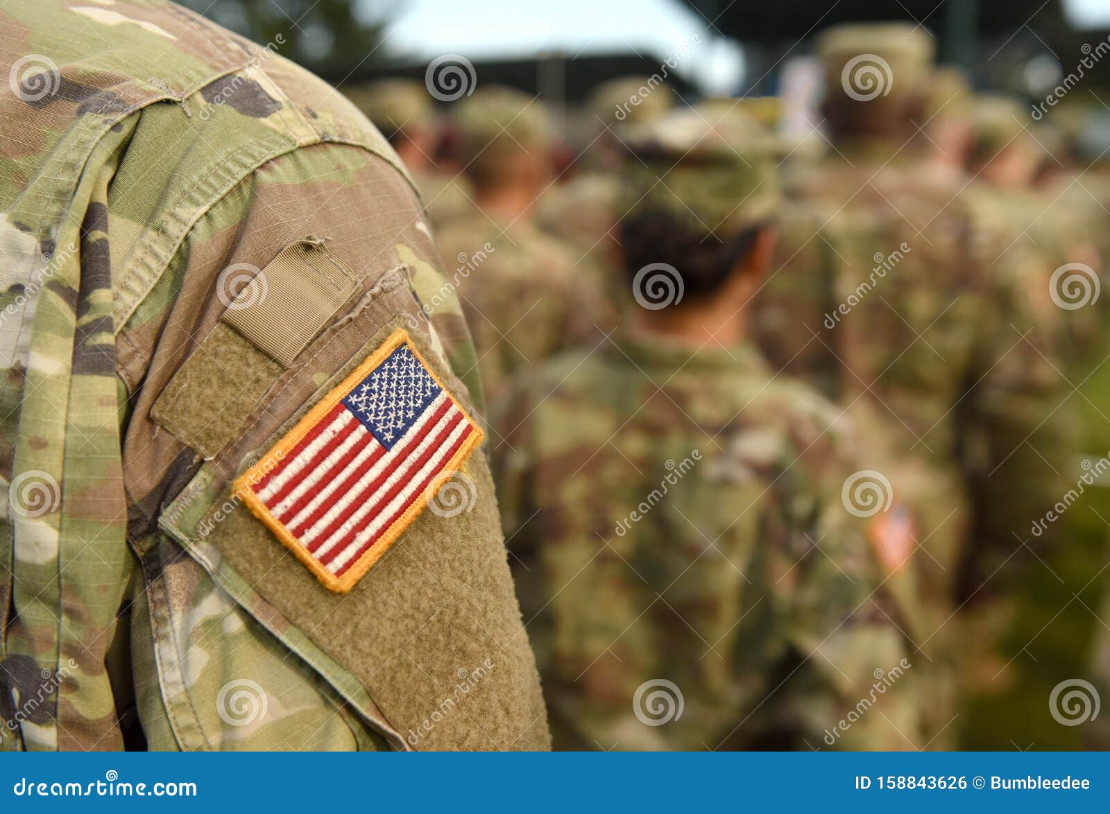 american soldiers and flag of usa on soldiers arm. us army. veteran day