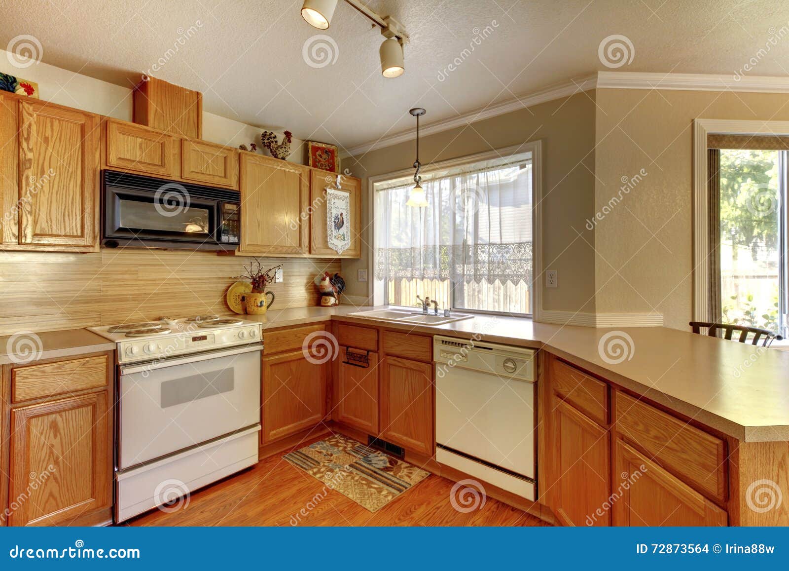 American Typical Kitchen Interior with White Appliances. Stock Photo
