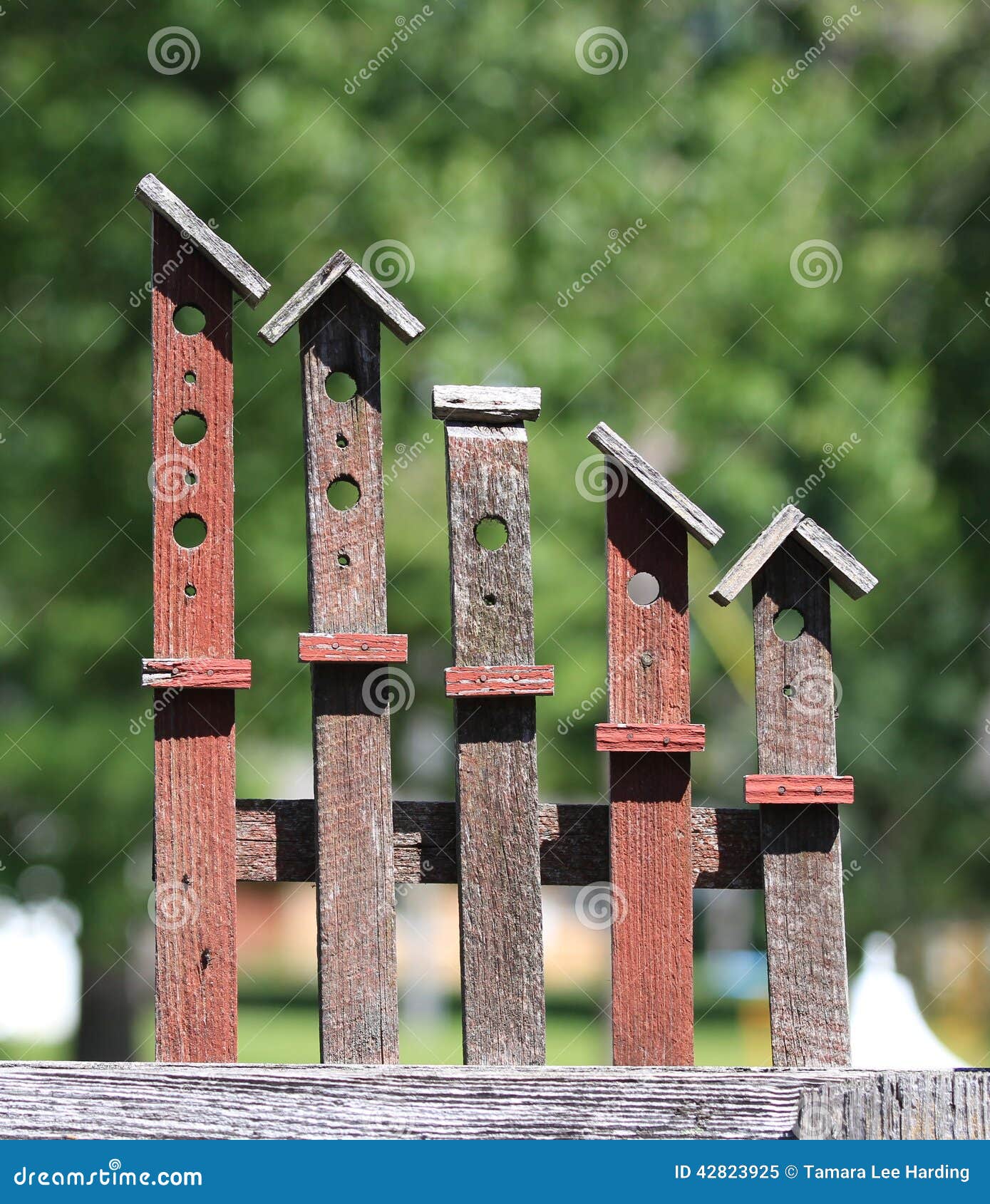 Americana Wooden Yard Art Birdhouses Stock Image - Image 