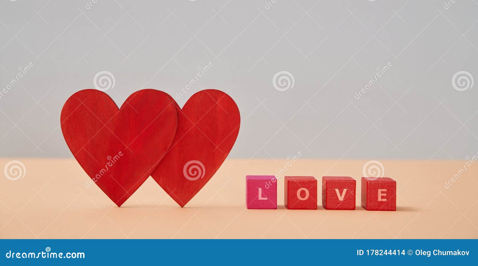 amour and fondness. saint valentines day. love and relationship. two red hearts, wooden cubes with love inscription