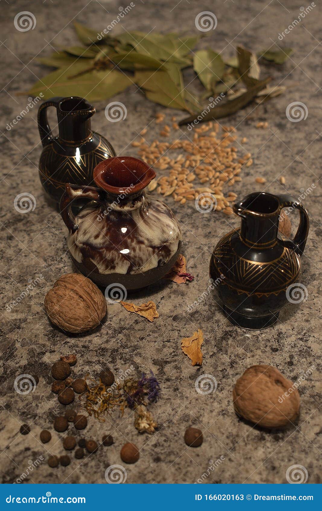 Amphorae on a stone table stock image. Image of next 166020163
