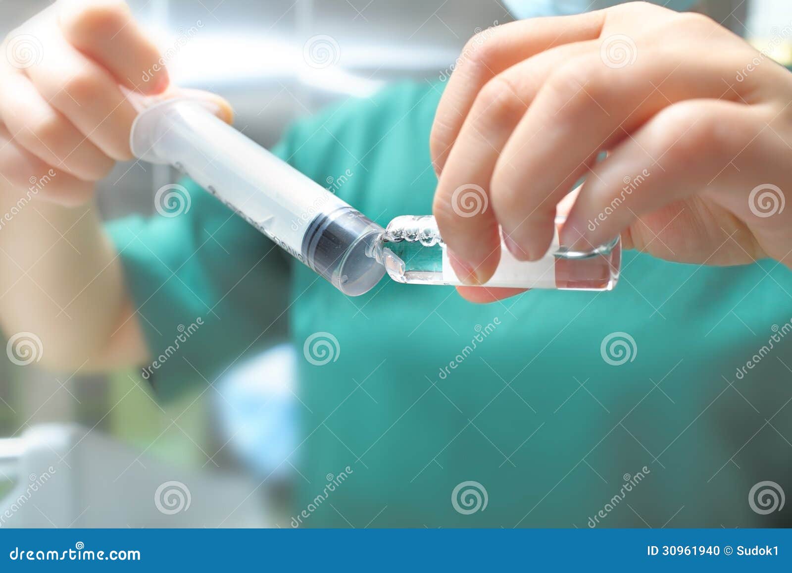 Ampoule and Syringe in the Hands of a Nurse. Stock Photo Image of
