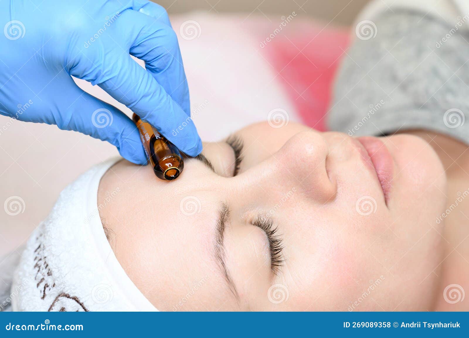 ampoule with vitamin c for application directly to the face for the mesotherapy procedure with the help of a dermapen.
