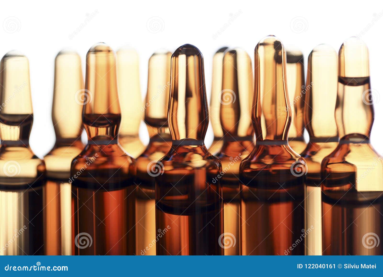 ampoules of glass with vaccine photographed in white light.