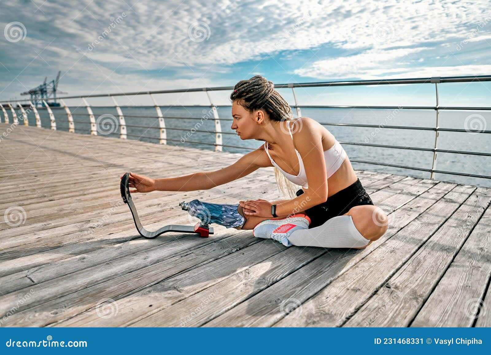 Amputated Woman. Image of a Beautiful Young Woman Doing Slopes and  Stretching Prosthetic Leg on a Bridge Near Sea Stock Image - Image of  adult, athletic: 231468331