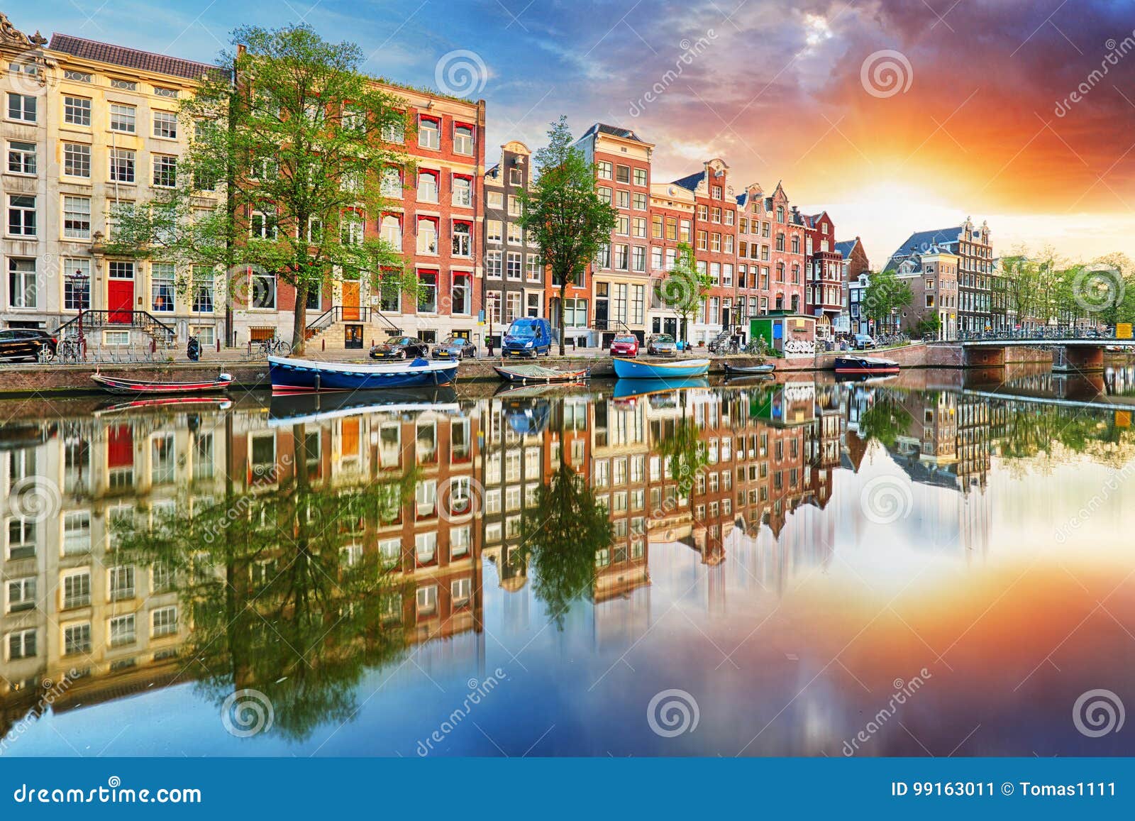 amsterdam canal houses at sunset reflections, netherlands, panorama