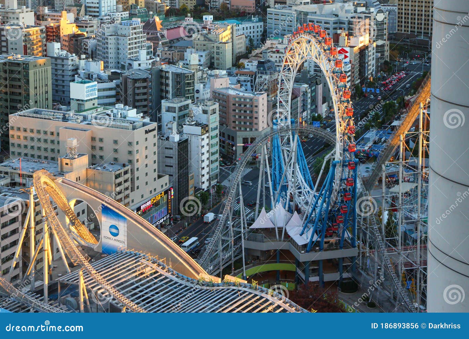 Amusement Park in the Center of Tokyo. Roller Coaster Intertwining with Skyscrapers Editorial