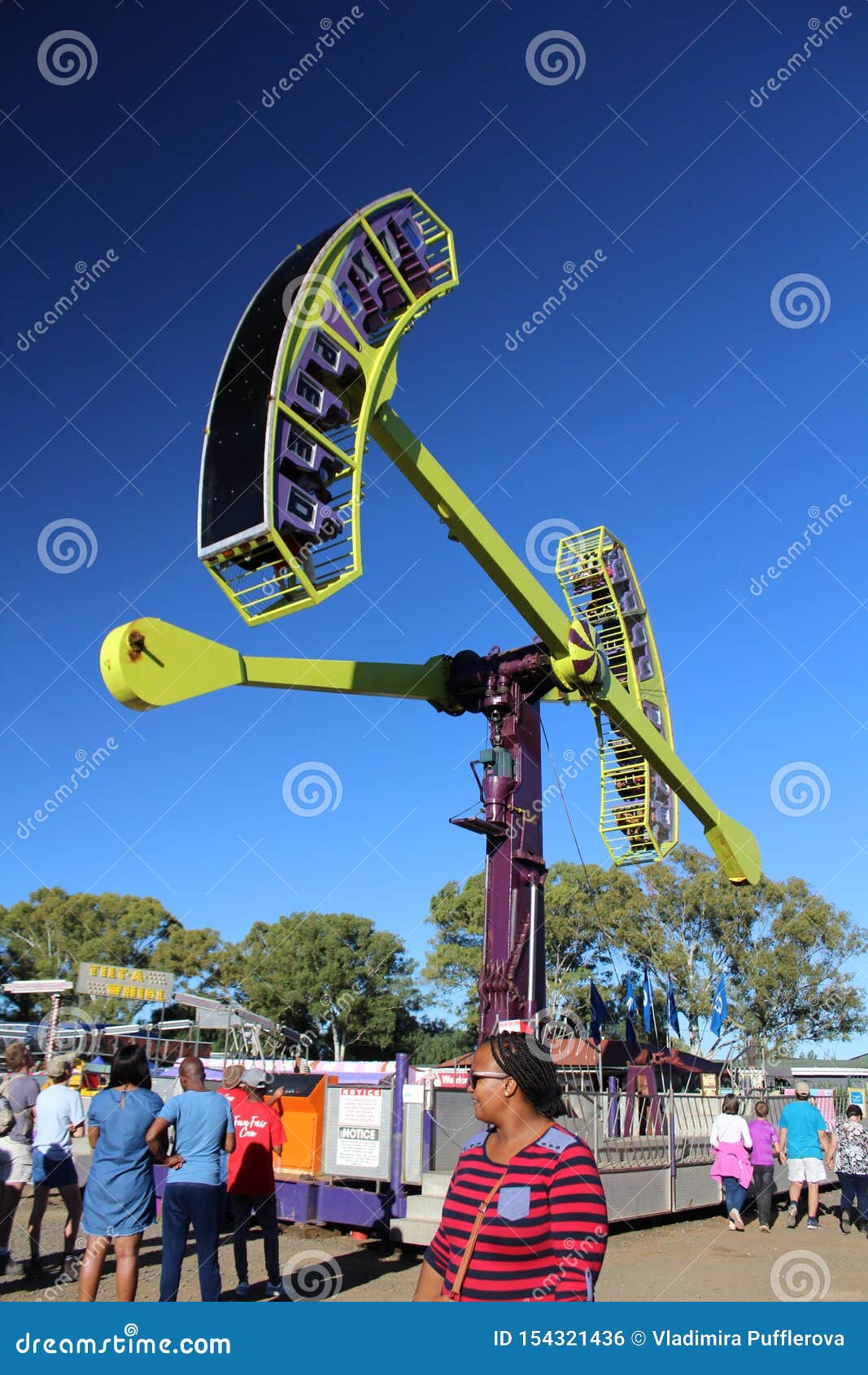 Amusement Ride - the Looping Starship in a Park Full of People ...