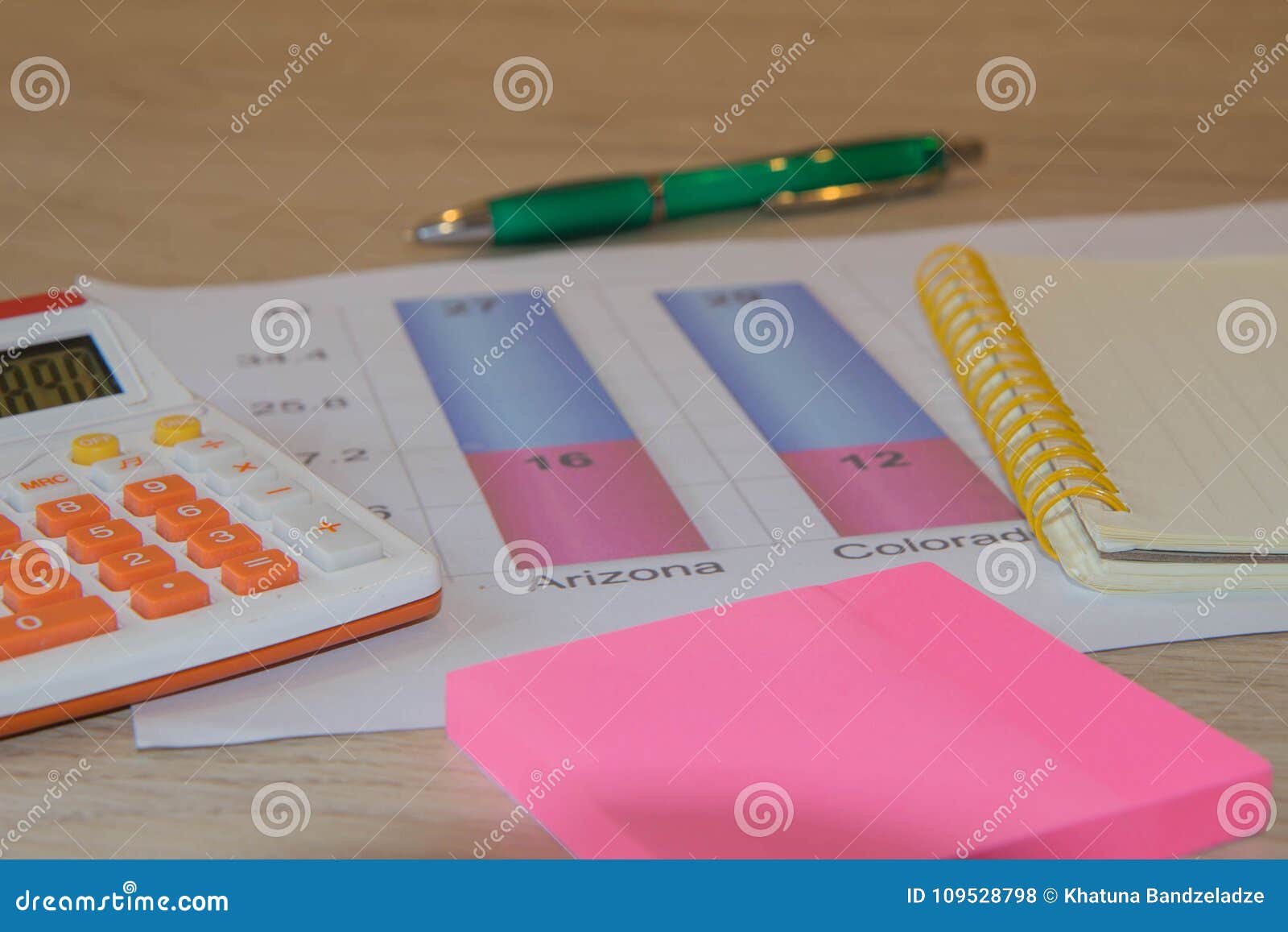 Analyzing Financial Data and Counting on Calculator Stock Photo Image